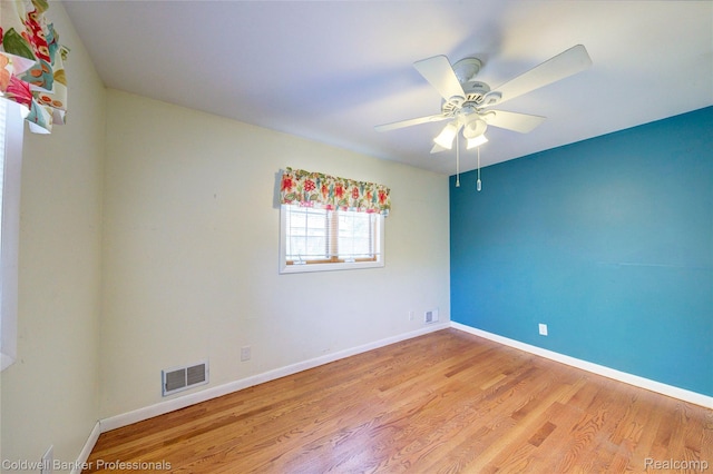 290 Florawood Blvd, Waterford, MI 48327 - spare room with light wood-type flooring and a ceiling fan