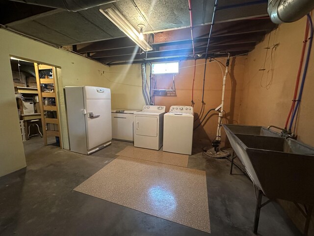 501 W 13th St, Cadillac, MI 49601 - below grade area with freestanding refrigerator and washing machine and dryer