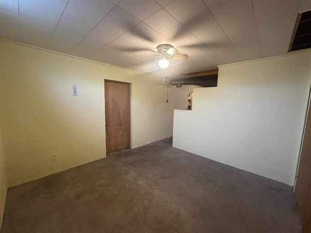 501 W 13th St, Cadillac, MI 49601 - unfurnished room featuring unfinished concrete flooring and a ceiling fan