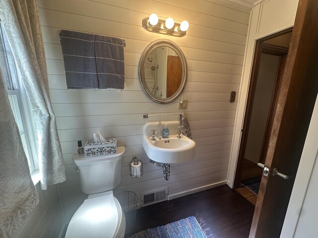 501 W 13th St, Cadillac, MI 49601 - bathroom featuring wood walls and wood finished floors