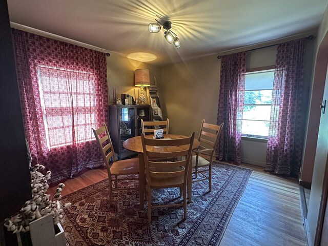 501 W 13th St, Cadillac, MI 49601 - dining area with wood finished floors and crown molding