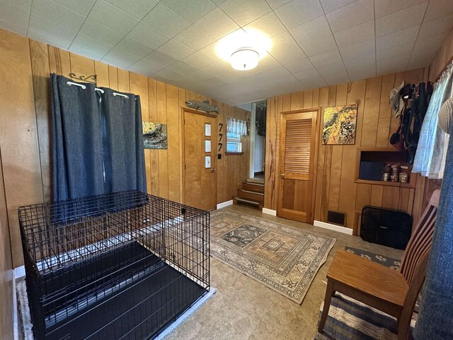 501 W 13th St, Cadillac, MI 49601 - foyer entrance featuring wooden walls and stairs