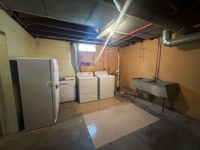 501 W 13th St, Cadillac, MI 49601 - basement featuring washer and clothes dryer and freestanding refrigerator