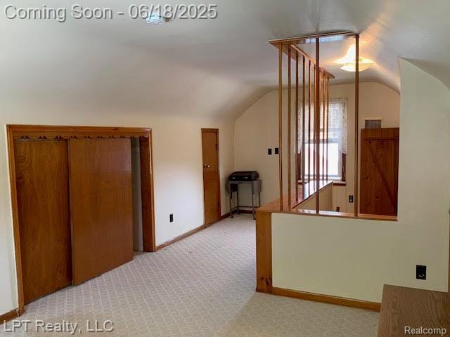 1811 Goddard Rd, Lincoln Park, MI 48146 - hallway with lofted ceiling and light colored carpet