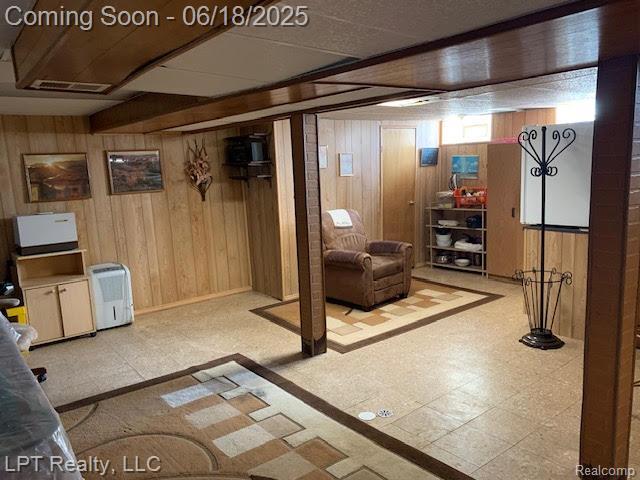 1811 Goddard Rd, Lincoln Park, MI 48146 - below grade area with wood walls and tile patterned floors