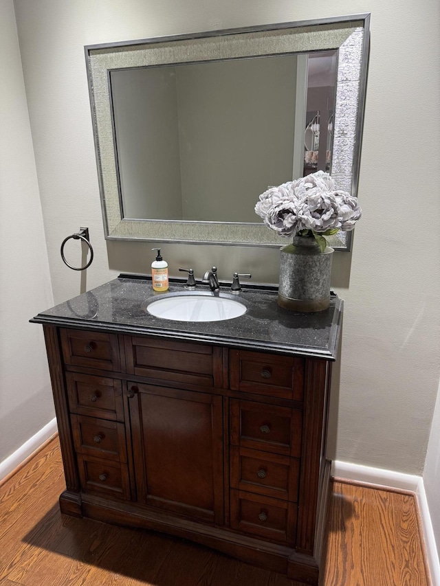 5653 Powder Horn Dr, West Bloomfield, MI 48322 - bathroom with vanity and wood finished floors