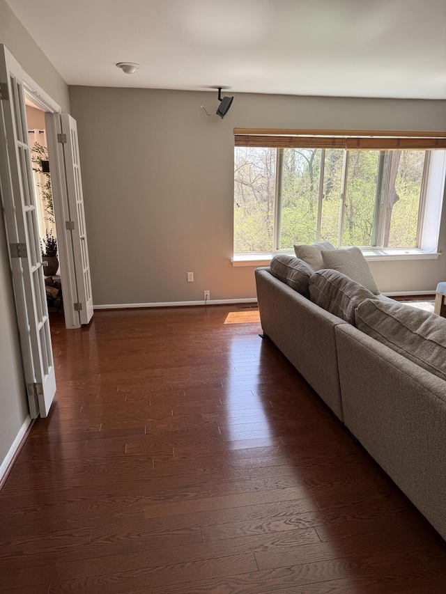 5653 Powder Horn Dr, West Bloomfield, MI 48322 - living area featuring healthy amount of natural light and dark wood-type flooring
