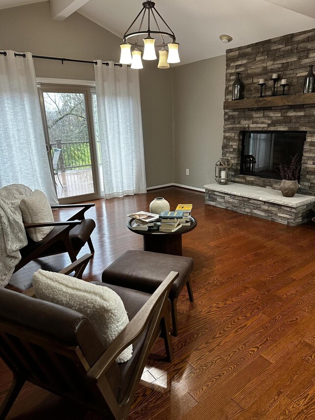 5653 Powder Horn Dr, West Bloomfield, MI 48322 - living area featuring wood finished floors, a chandelier, and a fireplace