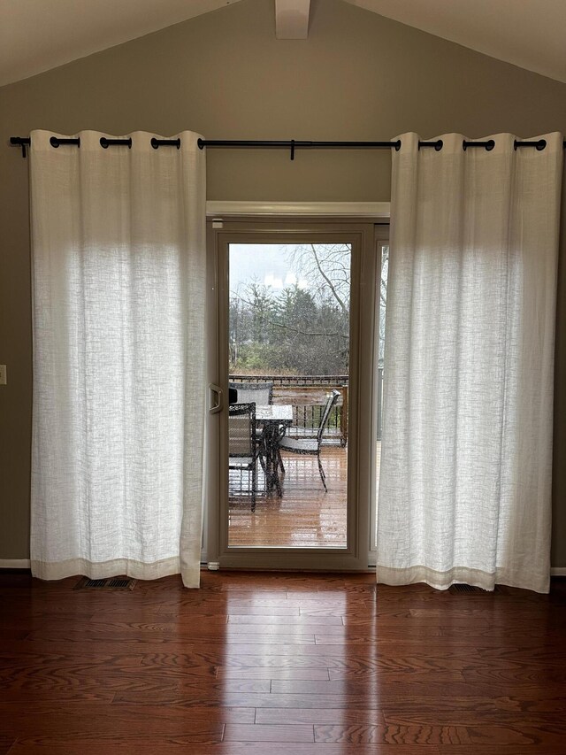 5653 Powder Horn Dr, West Bloomfield, MI 48322 - doorway to outside featuring vaulted ceiling and wood finished floors