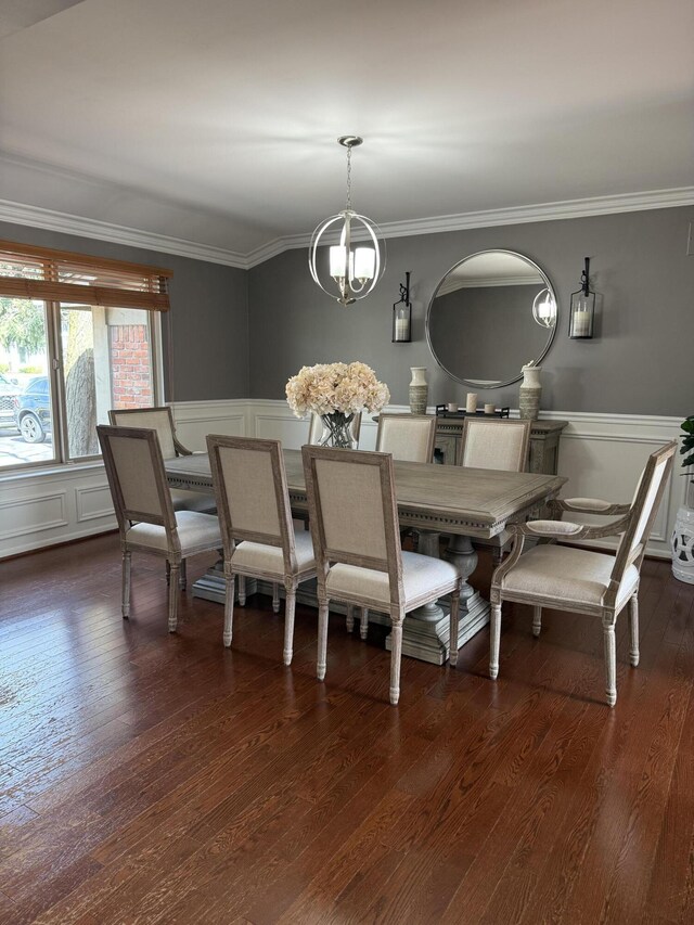 5653 Powder Horn Dr, West Bloomfield, MI 48322 - dining room featuring crown molding, wainscoting, a chandelier, dark wood-style flooring, and a decorative wall