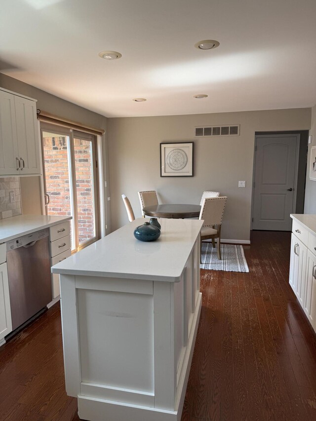 5653 Powder Horn Dr, West Bloomfield, MI 48322 - kitchen with dishwasher, dark wood-style flooring, and light countertops