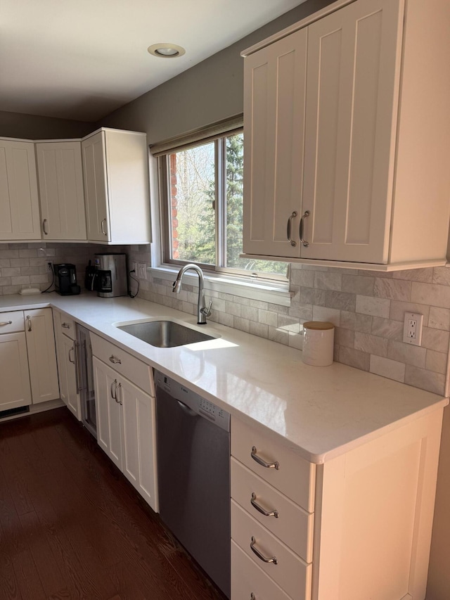 5653 Powder Horn Dr, West Bloomfield, MI 48322 - kitchen featuring stainless steel dishwasher, dark wood-style floors, white cabinetry, tasteful backsplash, and recessed lighting
