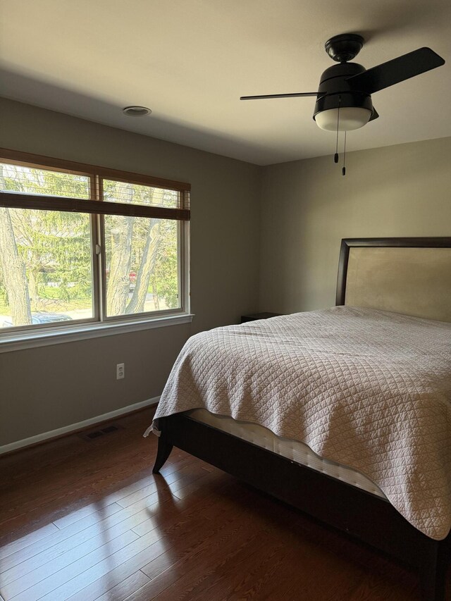 5653 Powder Horn Dr, West Bloomfield, MI 48322 - bedroom featuring multiple windows, wood finished floors, and a ceiling fan