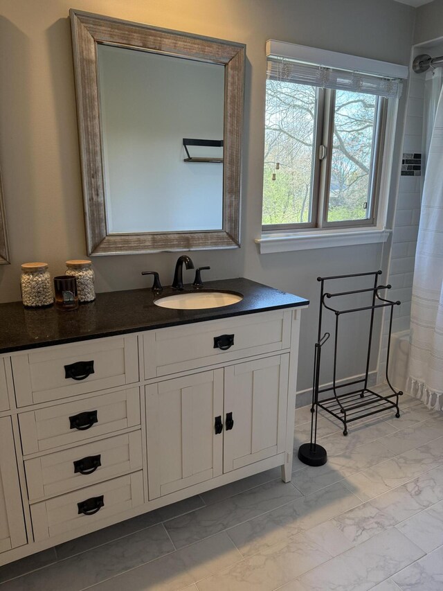 5653 Powder Horn Dr, West Bloomfield, MI 48322 - bathroom with marble finish flooring, vanity, and curtained shower