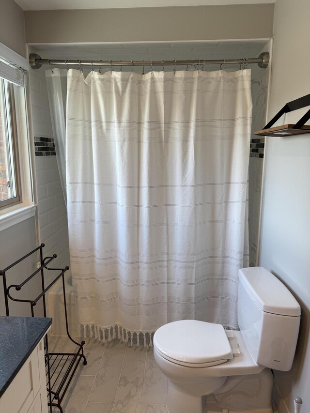 5653 Powder Horn Dr, West Bloomfield, MI 48322 - full bathroom with vanity, marble finish flooring, and curtained shower