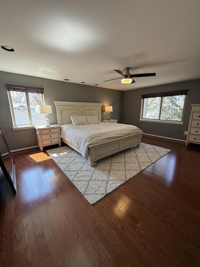 5653 Powder Horn Dr, West Bloomfield, MI 48322 - bedroom with multiple windows, dark wood finished floors, and ceiling fan
