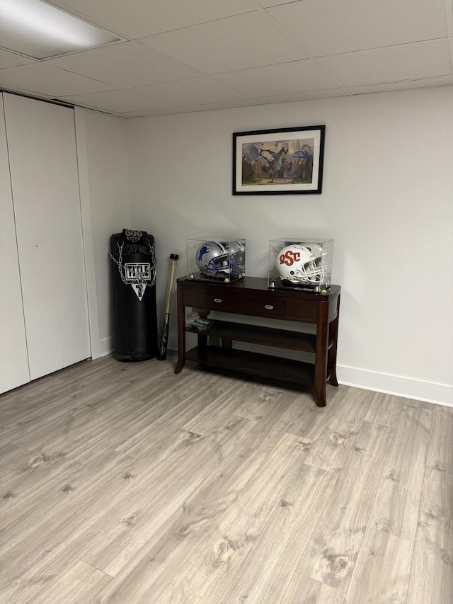 5653 Powder Horn Dr, West Bloomfield, MI 48322 - below grade area featuring a drop ceiling and light wood-style flooring