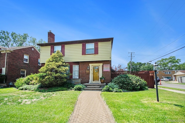 16251 Prest St, Detroit, MI 48235 - colonial inspired home featuring a chimney and brick siding