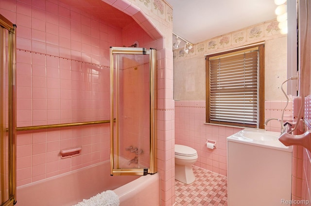 16251 Prest St, Detroit, MI 48235 - bathroom featuring tile walls, vanity, tile patterned flooring, shower / bath combination with glass door, and a wainscoted wall
