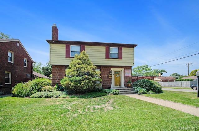 16251 Prest St, Detroit, MI 48235 - colonial home featuring a chimney and brick siding