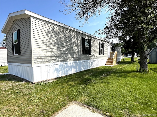 1048 Pheasant Dr, Bay City, MI 48706 - view of property exterior with a lawn