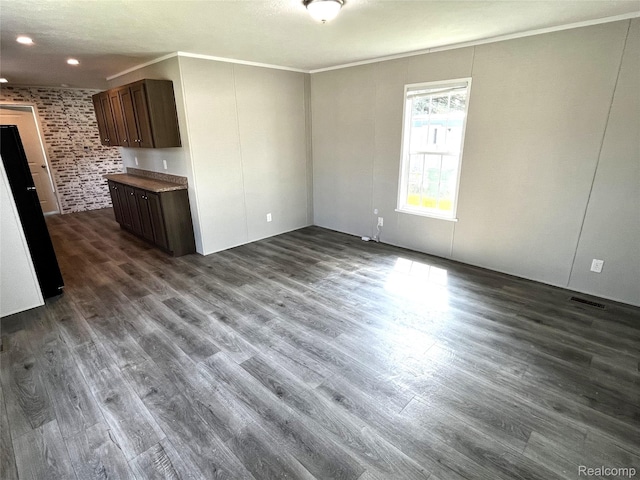 1048 Pheasant Dr, Bay City, MI 48706 - unfurnished living room featuring crown molding, dark wood-type flooring, and recessed lighting