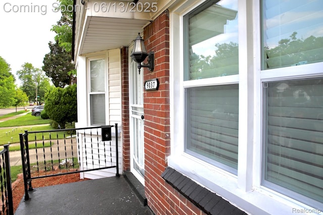 9037 Longacre St, Detroit, MI 48228 - property entrance featuring covered porch and brick siding
