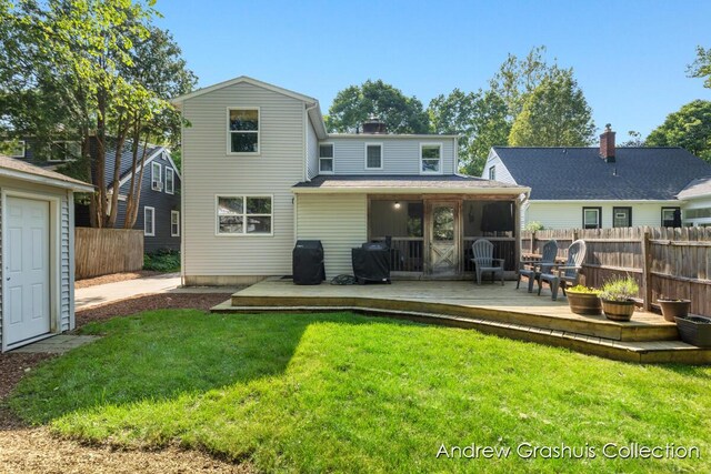 1142 Orchard Ave SE, Grand Rapids, MI 49506 - rear view of property featuring a deck and a chimney