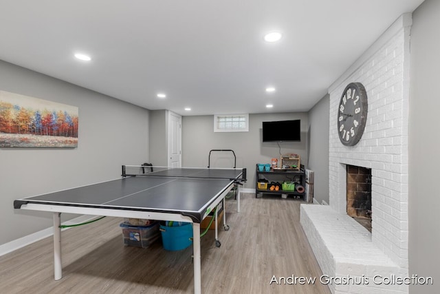 1142 Orchard Ave SE, Grand Rapids, MI 49506 - playroom featuring wood finished floors, recessed lighting, and a fireplace