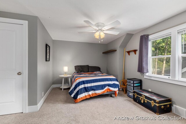 1142 Orchard Ave SE, Grand Rapids, MI 49506 - carpeted bedroom with baseboards and a ceiling fan