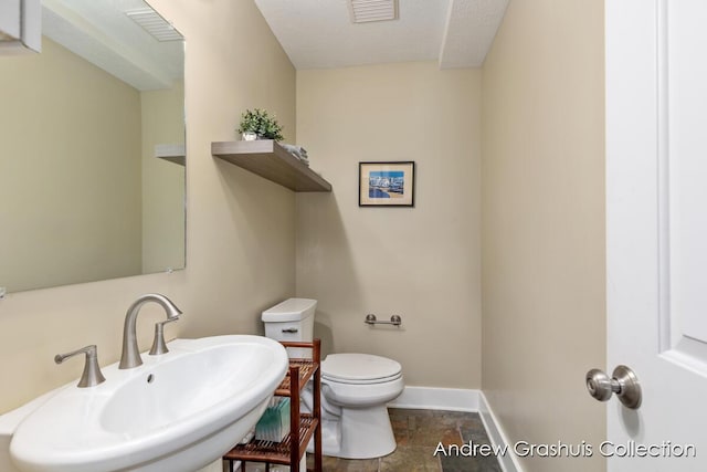 1142 Orchard Ave SE, Grand Rapids, MI 49506 - bathroom featuring a sink and stone finish flooring