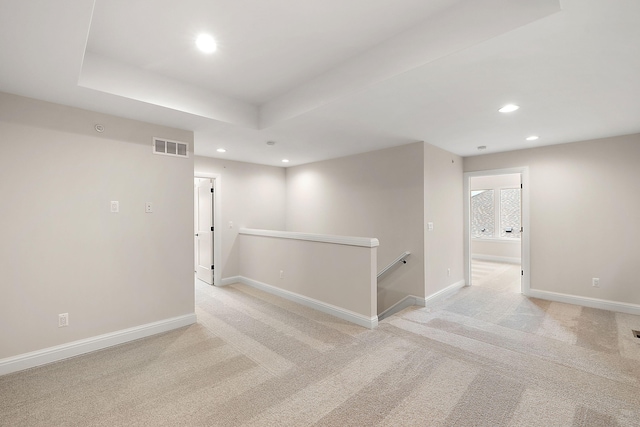 7479 Gramercy Cir W, Bloomfield, MI 48322 - spare room featuring recessed lighting, light colored carpet, and a tray ceiling