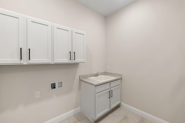 7479 Gramercy Cir W, Bloomfield, MI 48322 - laundry room with washer hookup, cabinet space, and light tile patterned flooring