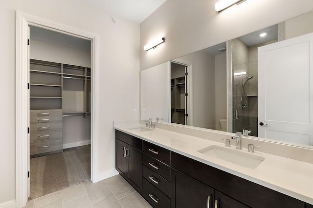 7479 Gramercy Cir W, Bloomfield, MI 48322 - full bath with a walk in closet, double vanity, a shower stall, and tile patterned flooring