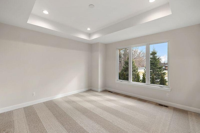 7479 Gramercy Cir W, Bloomfield, MI 48322 - empty room with a tray ceiling, recessed lighting, and light carpet
