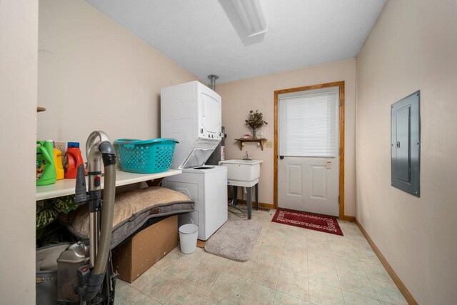 10765 Northland Dr, Big Rapids, MI 49307 - laundry room featuring stacked washer / drying machine and electric panel