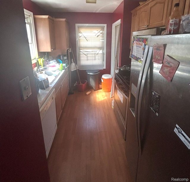 11701 Forrer St, Detroit, MI 48227 - kitchen featuring stainless steel refrigerator with ice dispenser, light wood finished floors, white dishwasher, and light countertops