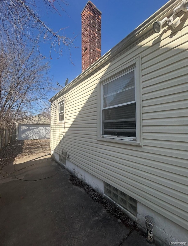 11701 Forrer St, Detroit, MI 48227 - view of property exterior featuring a chimney and an outdoor structure