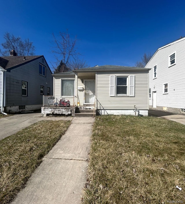 11701 Forrer St, Detroit, MI 48227 - view of front of house featuring covered porch and a front lawn