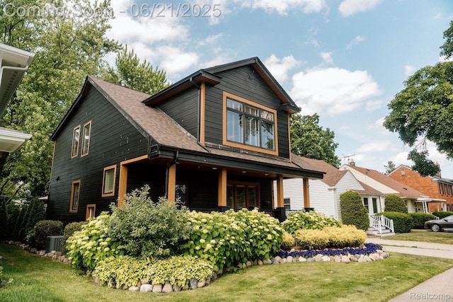 619 E Farnum Ave, Royal Oak, MI 48067 - view of front of home with a front lawn, a shingled roof, and french doors