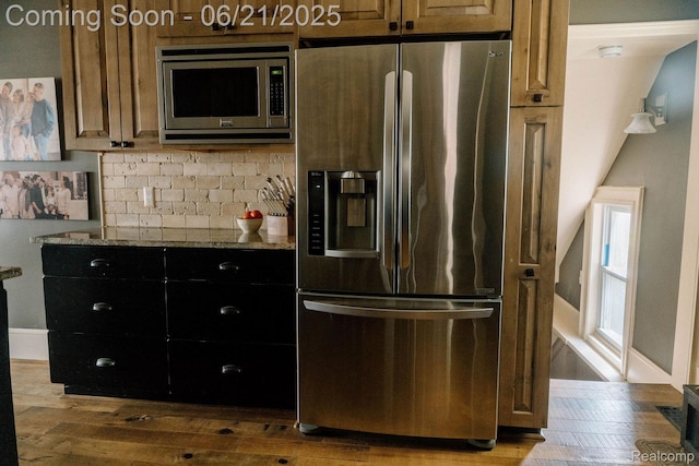 619 E Farnum Ave, Royal Oak, MI 48067 - kitchen featuring stainless steel appliances, hardwood / wood-style flooring, light stone countertops, and tasteful backsplash