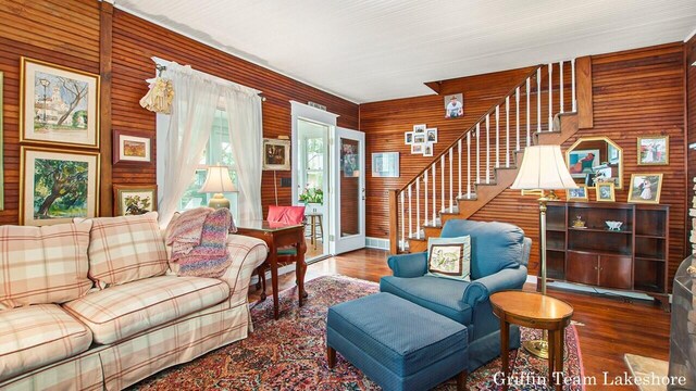 1194 Beach Dr, Holland, MI 49423 - living room with stairs, wood finished floors, and wood walls