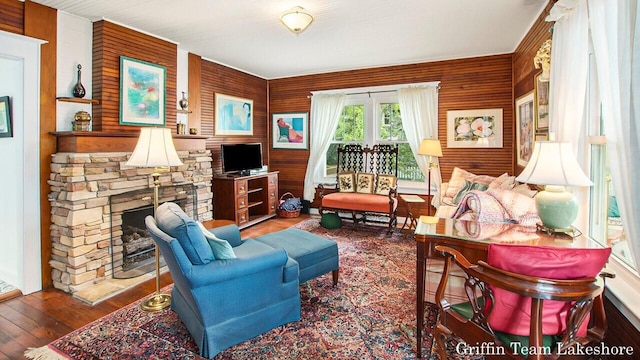 1194 Beach Dr, Holland, MI 49423 - living area featuring hardwood / wood-style floors and a stone fireplace