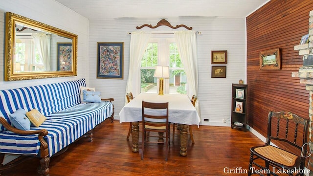 1194 Beach Dr, Holland, MI 49423 - living area with wood-type flooring and wood walls