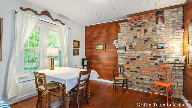 1194 Beach Dr, Holland, MI 49423 - dining room featuring wood walls and wood-type flooring