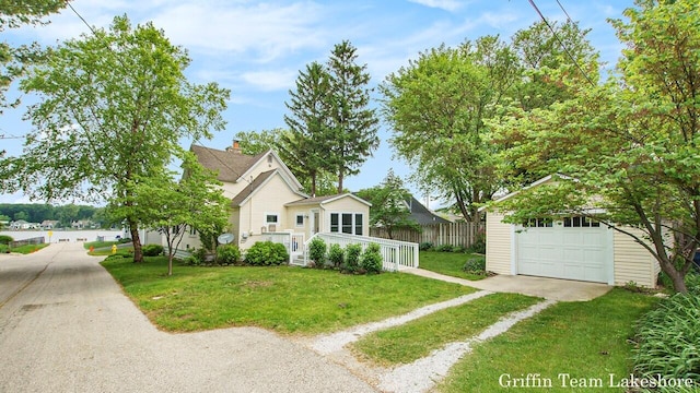 1194 Beach Dr, Holland, MI 49423 - view of front of home featuring driveway and a garage