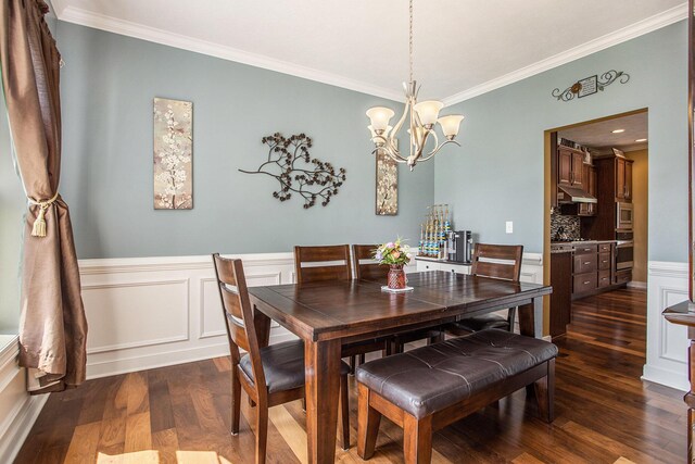7990 Hemel Ln, Richland, MI 49083 - dining area featuring ornamental molding, dark wood-type flooring, a chandelier, and a wainscoted wall