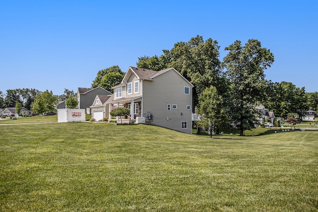 7990 Hemel Ln, Richland, MI 49083 - view of home's exterior featuring a yard and a garage