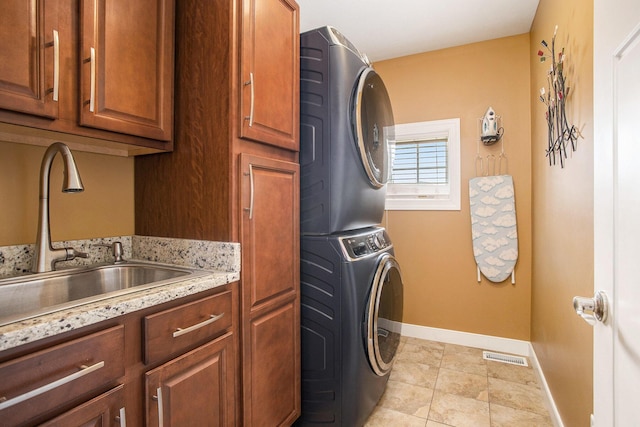 7990 Hemel Ln, Richland, MI 49083 - laundry area with stacked washer / drying machine and cabinet space