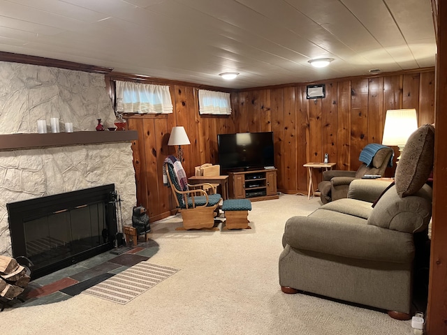 261 W Main St, Hart, MI 49420 - living room featuring carpet flooring, a fireplace, and wooden walls